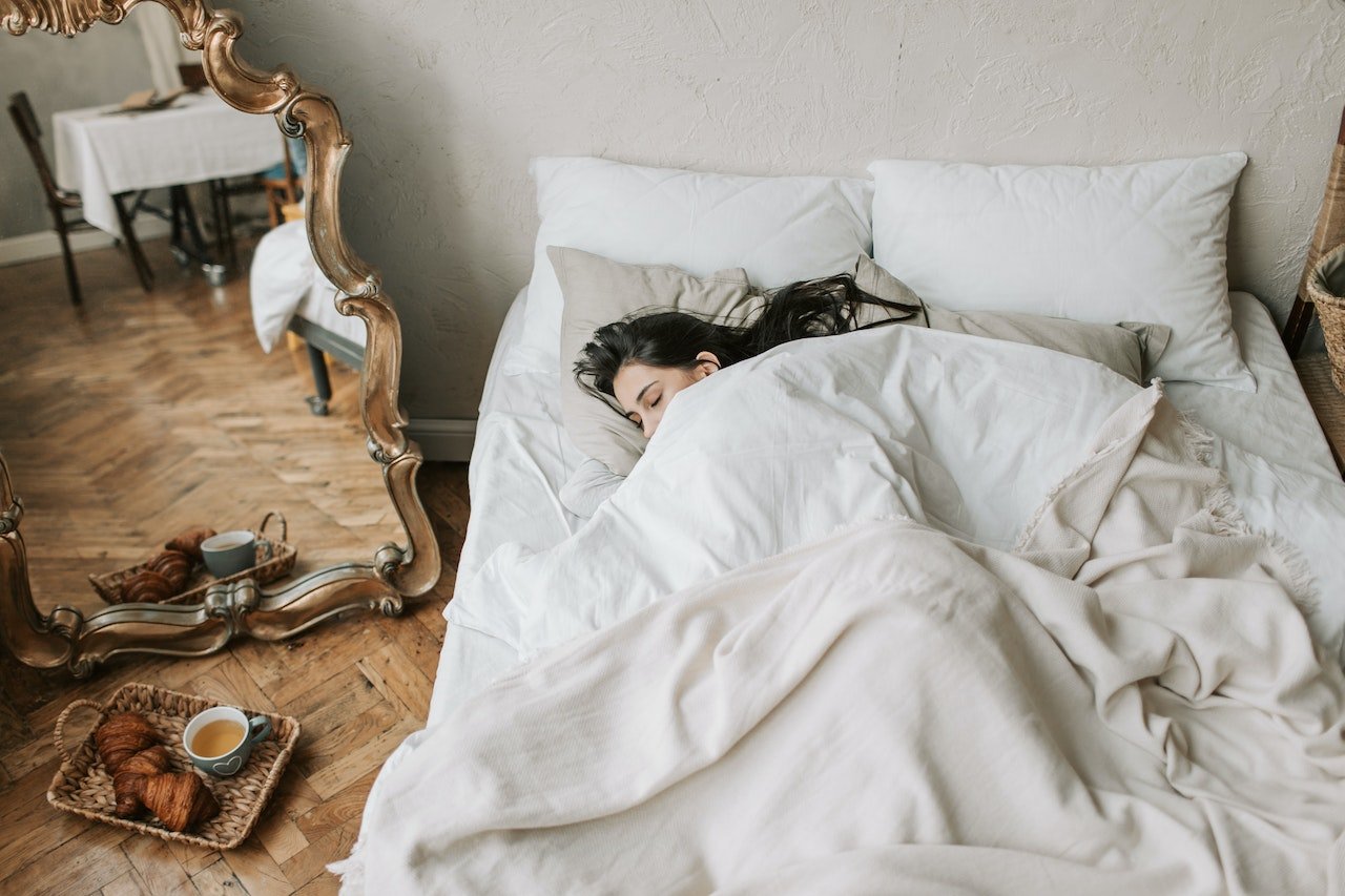 woman sleeping on the bed
