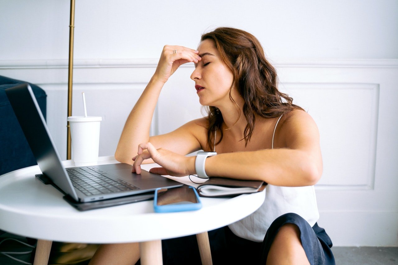 Woman at work looking exhausted