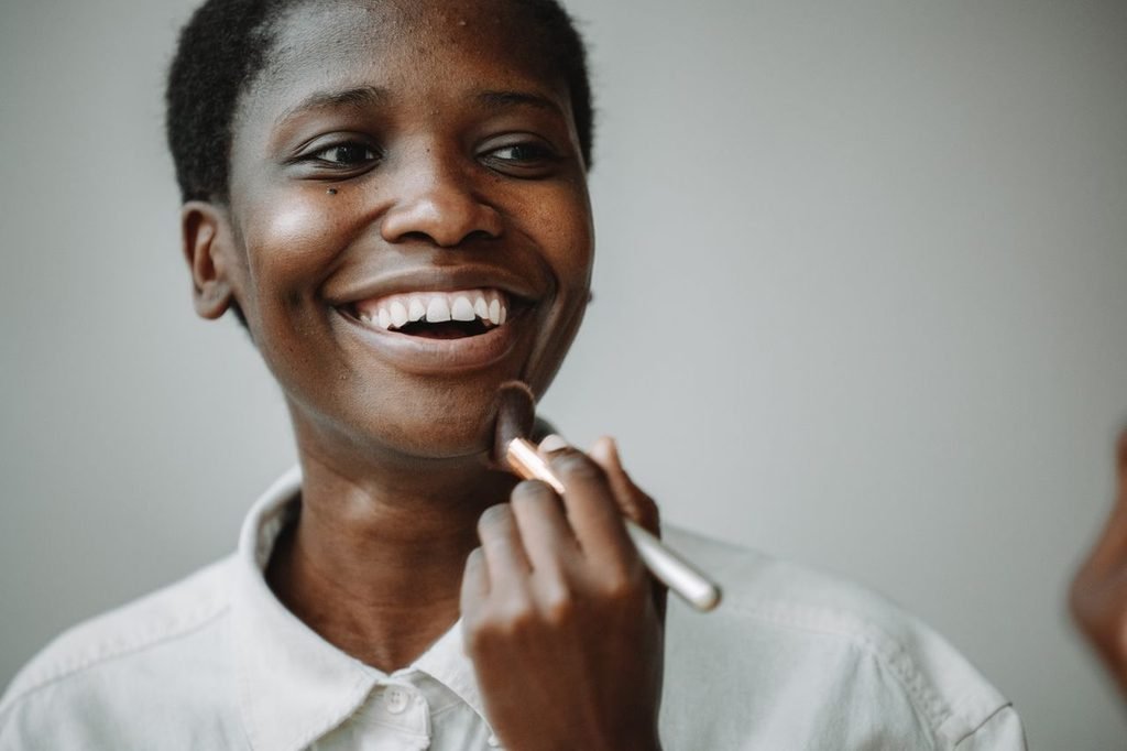7 pillars of self-care: woman doing make up