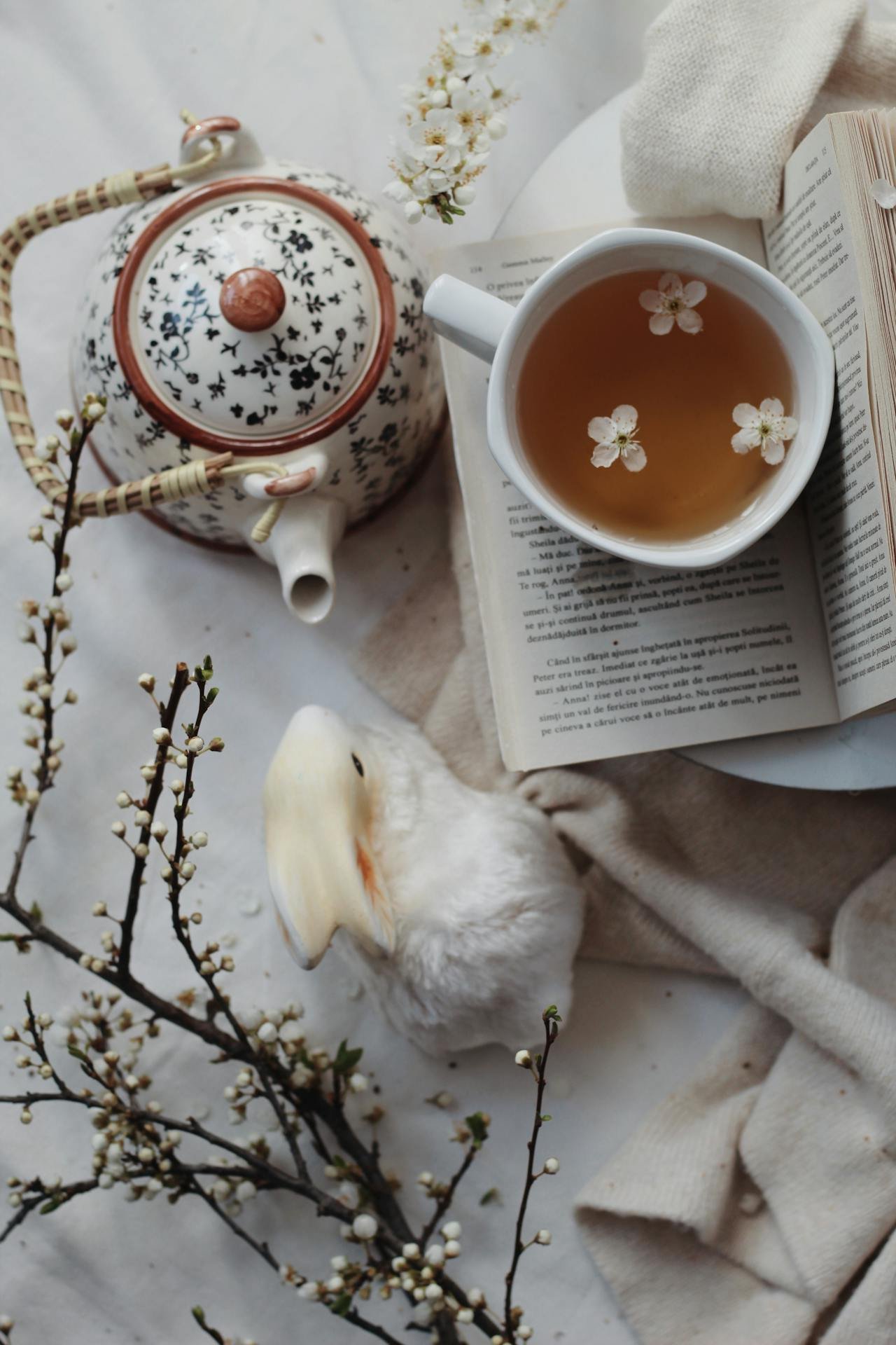 Table with tea and book representing quiet mornings