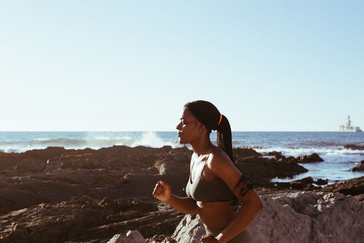Daily Wellness Habits That Actually Transform Your Life: woman jogging