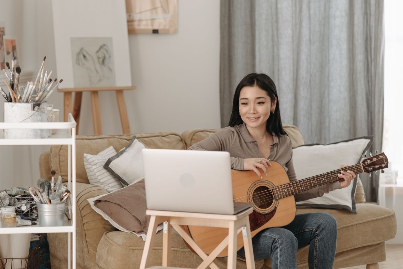 woman playing a guitar