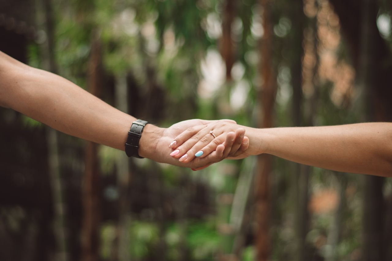 two people holding hands