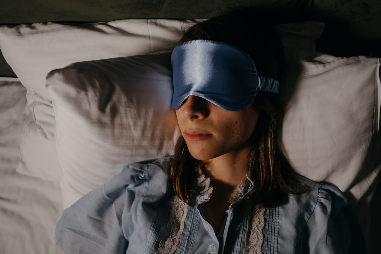 asleep woman wearing eye mask